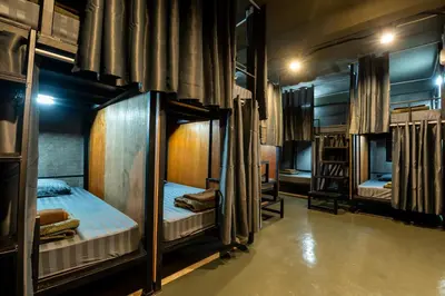 a group of bunk beds in a room at Another High Away Hostel - Bangkok in Nonthaburi