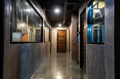 an empty hallway with a door and a hallwayngthngthngthngthngthngthngth at Another High Away Hostel - Bangkok in Nonthaburi