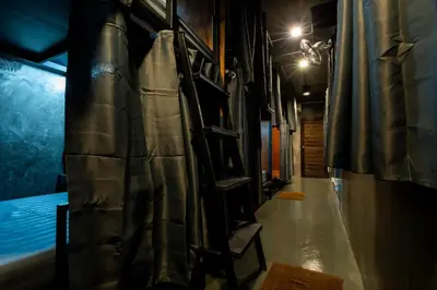 a long hallway of a room with a tent at Another High Away Hostel - Bangkok in Nonthaburi