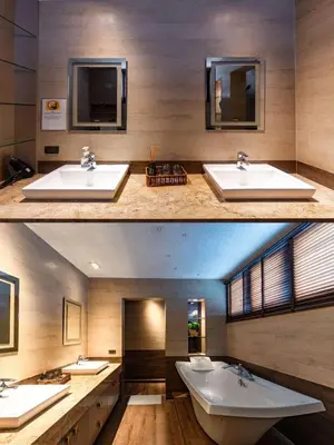 two pictures of a bathroom with a tub and a sink at Thonglor 25 Noble House in Bangkok