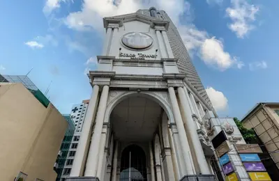 a building with a clock tower on top of it at 2 bedroom state tower Sathorn in Bangkok