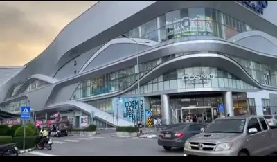 a large building with cars parked in front of it at Popular Muang Thong Condo, Building C5 in Ban Bang Phang