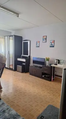 a large living room with a television and a desk at Popular Muang Thong C5 in Thung Si Kan