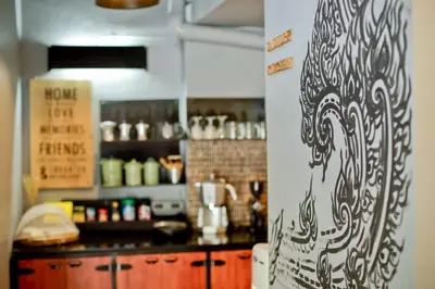a kitchen with a counter and a counter top at Bangkok Bed and Bike in Bangkok
