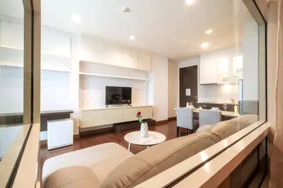 a living room with a couch and a table at Ivy Thonglor Luxury Condo with Swimming Pool, Fast Wifi in Bangkok