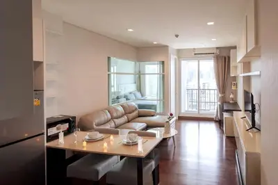 a living room with a couch and a table at Ivy Thonglor Luxury Condo with Swimming Pool, Fast Wifi in Bangkok