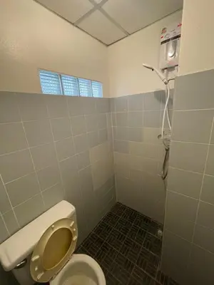 a bathroom with a toilet and a shower at Sairin 1 bedroom BTS Udomsuk in Bangna
