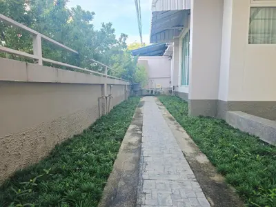 a walkway next to a building next to a building at Elegant Home near MRT Central WestGate and Central WestVille 3 to 10 Min Drive