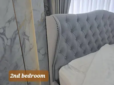 a close up of a bed in a bedroom at Elegant Home near MRT Central WestGate and Central WestVille 3 to 10 Min Drive