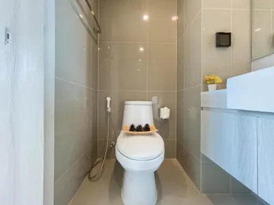 a bathroom with a toilet with a bowl on top of it at CBD Living 2 BR ︱Prime Sukhumvit ︱Walk to BTS Asok & MRT SKV ︱UltraWi-Fi in Bangkok