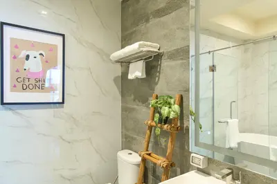 a bathroom with a toilet and a picture of a dog at 5loft Anti-Hotel, Silom, Bangkok in Bangkok