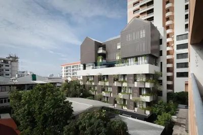 an apartment building with balconies on the side of it at Bangkok Tryp in Bangkok