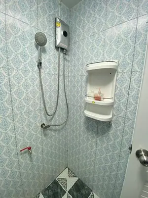 a bathroom with a shower with a shower at Baan Alisa 12 in Nonthaburi