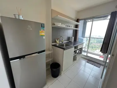 a small kitchen with a sink and a refrigerator at Cozy6 Living in Bangkok 60m to MRT near chatuchank in Ban Bang Khwang