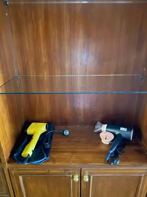 two pairs of scissors sitting on top of a wooden cabinet at Chic Bangkok Escape & Fast Wifi in Bangkok