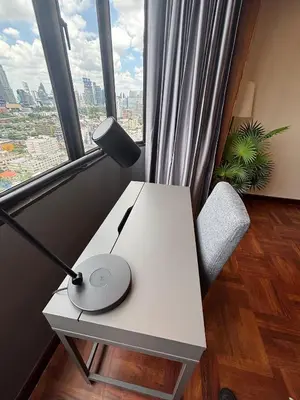 a white desk with a lamp and a chair in front of a window at Chic Bangkok Escape & Fast Wifi in Bangkok