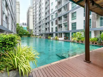 a swimming pool in the middle of a building at A space by cream in Bangkok