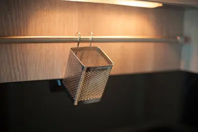 a metal object is hanging on a wall at Knightsbridge Duplex Tiwanon by Natcha in Nonthaburi