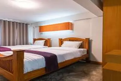 a bedroom with two beds in a room at xx GO INN Khaosan Road Bangkok - โก อินน์ ถนนข้าวสาร in Bangkok