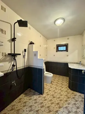 a bathroom with a shower and a toilet and a sink at 8Pax Spacious Private Home near The Mall Bangkapi in Ban Bang Toei (1)