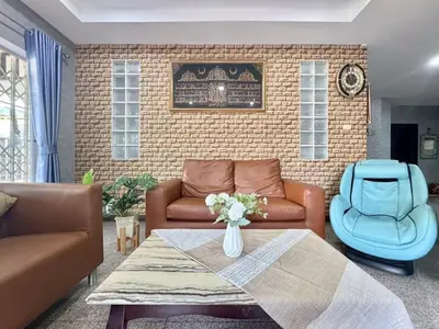 a living room with a couch and a table at 8Pax Spacious Private Home near The Mall Bangkapi in Ban Bang Toei (1)