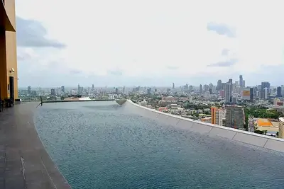 a view of a city from the top of a building at River View Modern 1BR - Weekly Cleaning - Phrom Phong in Bangkok