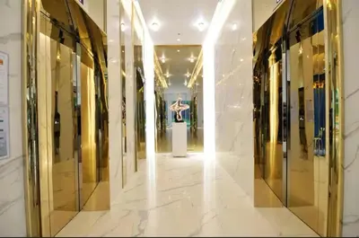 a hallway of a shopping mall with glass windows at Hyde Sukhumvit 11 Bankok in Bangkok