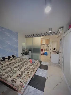 a bedroom with a large bed in a room at Stylish Bangkok Condo Furnished, Pool View Prime Location in Bangkok