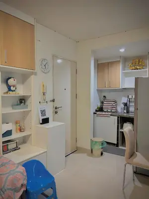 a kitchen with white cabinets and a blue stool at Stylish Bangkok Condo Furnished, Pool View Prime Location in Bangkok