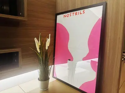 a sign sitting on a table with a plant at BTS Thong Lor Downtown Low-rise Large 1 Bedroom in Bangkok