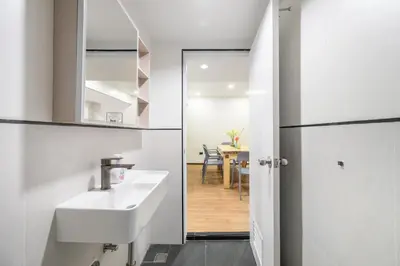 a bathroom with a sink and a mirror at 4BR House For Family&Friends in Bangkok