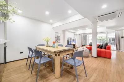 a dining room and living room with a table and chairs at 4BR House For Family&Friends in Bangkok