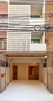 an external view of a building with two entrances at Slaap36 5BR Home with Parking, Walk to BTS Ari in Bangkok