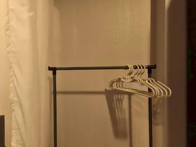 a towel rack in a bathroom with a shower curtain at Condo Studio Sukhumvit 115 BTS Pu Chao in Ban Khlong Samrong