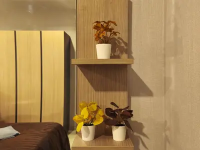 three potted plants on a shelf in a bedroom at Condo Studio Sukhumvit 115 BTS Pu Chao in Ban Khlong Samrong