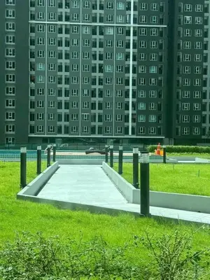a skate park in front of a tall building at Life city 1 in Bang Chak