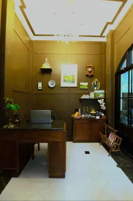 a room with a desk with a laptop on it at Casa Acero in Bangkok