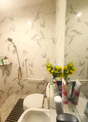 a bathroom with a sink and a toilet at Sheikh Stay In Hostel in Bangkok