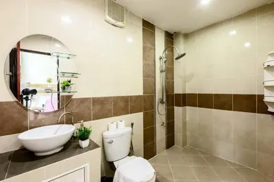 a bathroom with a toilet and a sink and a shower at Sheikh Stay In Hostel in Bangkok