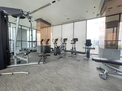 a gym with treadmills and cardio equipment in a building at Near BTS l Modern Luxury l By Sontana in Bangkok