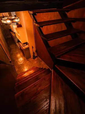 an overhead view of a staircase in a room with wooden floors at Boutique Suite 3BR x The Lobby Bar & Bed in Bang Kapi