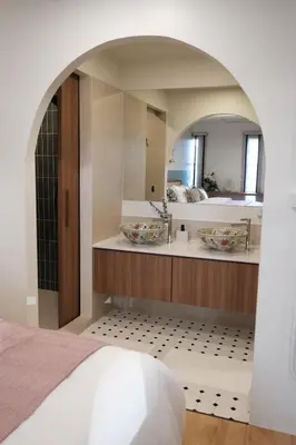 a bathroom with a sink and a mirror at The Shantipan Jasmine - Cozy City Retreat 400m from BTS Station in Bangkok