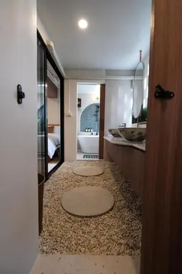 a bathroom with a toilet and a sink and a tub at The Shantipan Mandala - Cozy City Retreat 400m from BTS Station in Bangkok