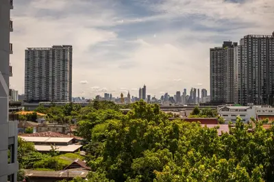 a view of a city skyline with tall buildings at Kanal Bangkok Service Residence in Ban Khlong Bang Chak