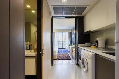 a kitchen with a washer and dryer in it at Relaxing place in Downtown, BKK in Bangkok