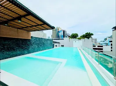 a swimming pool on the roof of a building at 6th Avenue Sukhumvit BKK Two Bedrooms BTS Asok Nana MRT Sukhumvit in Bangkok