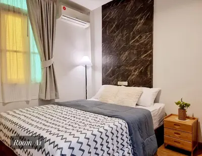 a bedroom with a bed with a black marble wall at Friend Nest Bangkok in Bangkok