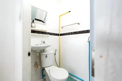 a bathroom with a toilet and a sink at XX Oh My Nap Sukhumvit 3 - สุขุมวิท 3 in Makkasan