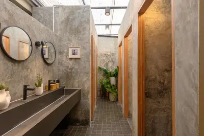 a bathroom with two sinks and a mirror at 4BR 10PAX 2min 7Eleven & 7min Commons Thonglor in Sathani Khlong Tan