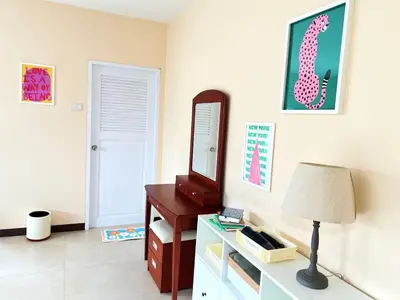 a room with a desk and a mirror and a lamp at Everything Within Minutes House in Bangkok